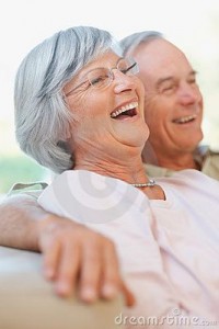 Happy retired old couple laughing out loud